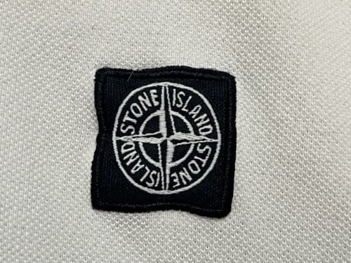 Stone island polo met badge hot sale