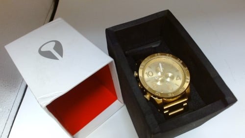 Nixon 14k best sale gold watch