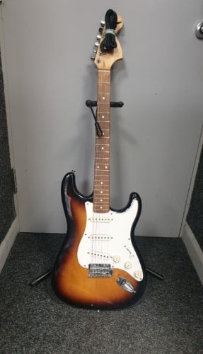 brown electric guitar